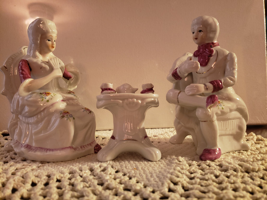 Porcelain Figurine of a man seating