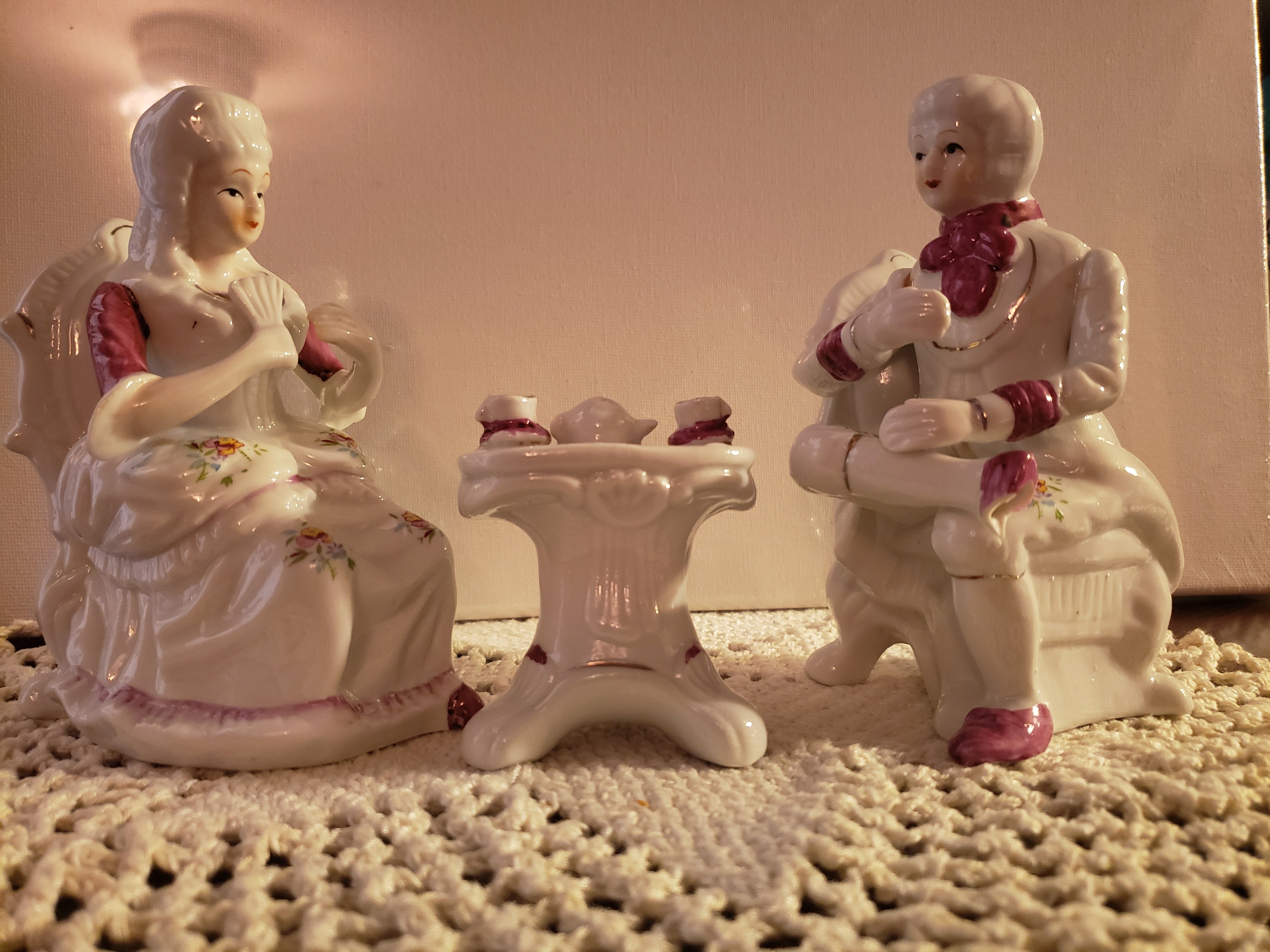 Porcelain Figurine of a man seating